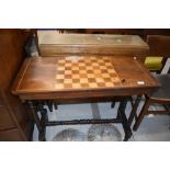 A Victorian games table, on turned frame, width approx. 83cm