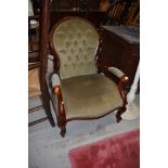 A reproduction button back easy chair on scroll frame