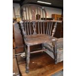 A traditional oak windsor armchair