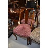 A pair of early 20th Century Queen Anne style vase back upholstered dining chairs