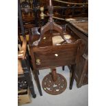 A 19th Century mahogany pot cupboard having gallery top on square legs