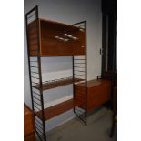 A vintage metal frame ladderax shelf unit with glazed display and three drawer sections