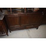 A period oak kist having three panel over double drawer base, dimensions approx. W122cm D52cm H78cm