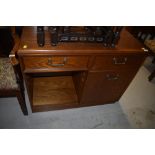 A mid to late 20th Century oak hifi or similar sideboard, having half cupboard and half shelved