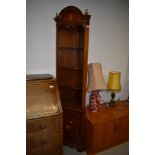 A Reproduction mahogany corner display with panelled cupboard under, in an Edwardian style, with