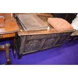 A period oak coffer/kist , having carved panel decoration, dimensions approx. W138cm D58cm H69cm