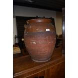 A large terracotta two handled pot, no lid