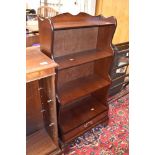 A mahogany shelf with drawer set