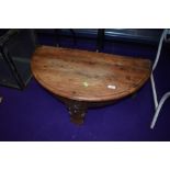 An Indonesian hardwood half moon coffee table, with storage