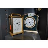 Two clocks of small size a Royal Doulton mantle clock and similar brass cased Wm, Widdop having