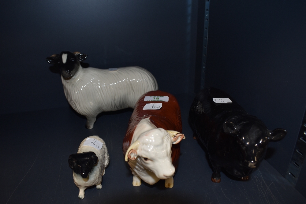 Two Beswick studies, Aberdeen Angus Bull 1562 and Hereford Bull 1363A along with two Coppercraft