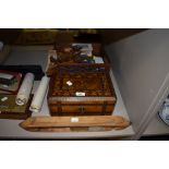 An antique inlaid wooden box with key, two carved oak desk top stacking shelves and a shuttle,