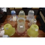 A collection of nine antique lamp shades including Uranium/Vaseline glass and similar, some