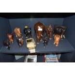 A selection of African tribal hand carved elephant figures and book end including ebony wood