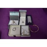 A small selection of silver and white metal jewellery including chains, pendant, earrings and