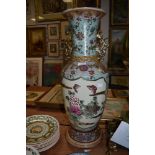 A modern decorative oriental style floor vase with gilt and bird of paridise decal, 67cm tall