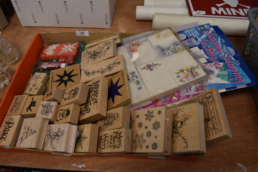 A box full of crafting stamps and similar.