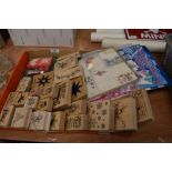 A box full of crafting stamps and similar.