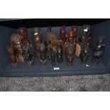 An impressive selection of hand carved African tribal heads and totems including Ghana, Maasai and