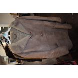 A vintage sheepskin coat having button front and pockets to sides,medium to large size.