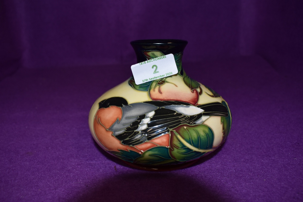 A modern Moorcroft (2003) Squat Vase having Bullfinch and Fruit decoration on cream ground, height