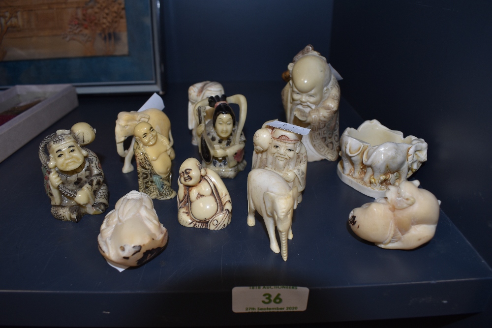 A selection of Chinese and Japanese style Netsuke and Okimono including imortal figure