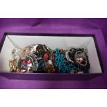 A selection of costume jewellery necklaces etc