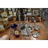 A variety of vintage fine plated wares including bon bon dishes, cruet, and candlestick holders,