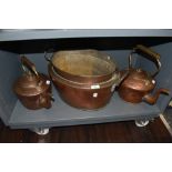 A selection of fire side copper wares including large stove kettles and twin handle bain marie