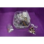 A box of costume jewellery including earrings, cufflinks and bangles