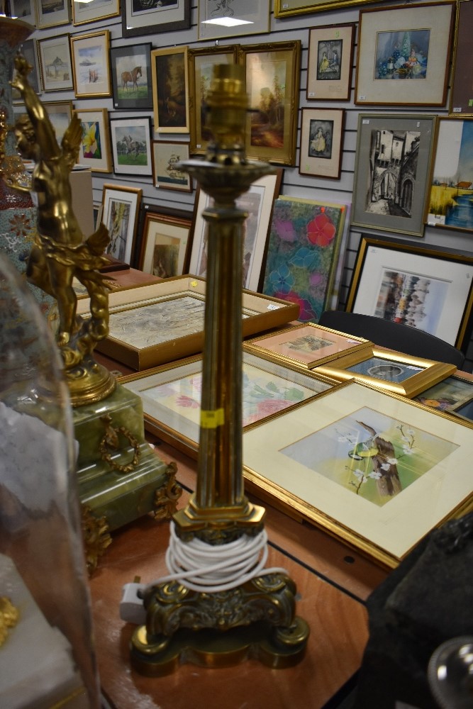 An impressive large brass table top lamp having ornate detail to base.