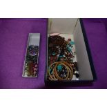 A selection of costume jewellery including enamelled hair slides and brooch, bead necklace etc