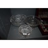 A selection of clear cut crystal glass wares including heavy cut bowls and footed tazza