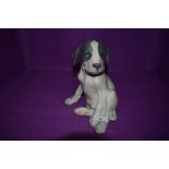 A Royal Copenhagen study, Seated Puppy, model no 259, height 21cm