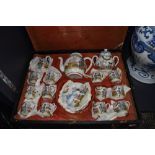 A Chinese export egg shell tea service having hand painted decoration and original case
