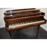 An early 20th Century baby grand piano, 85 key , in mahogany case on square tapered legs, signed