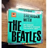 A collection of Beatles 7' singles including rare foreign pressing and rare picture sleeves.