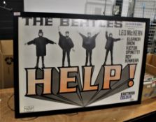 A large reproduction Beatles 'Help' poster.