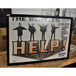 A large reproduction Beatles 'Help' poster.