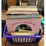 A box of various albums and 7' singles.