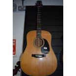 A Martin D-28 acoustic guitar, serial number 246438, dater project lists as 1969 , with blue