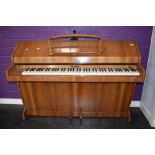 A mid 20th century walnut cased piano by Eavestaff, 'Pianette Mini Piano' six and a half octave