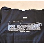 A lot of T shirts including Eric Clapton, queen, Eagles and more.