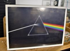 A large reproduction Pink Floyd 'Dark side of the moon' poster in frame.