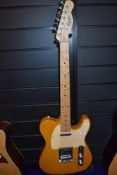 A Fender Squier Telecaster, with padded gig bag