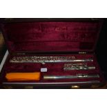 A Buffet Crampon flute , stamped made in England, BC6020, serial number 771283 (cooper scale), in