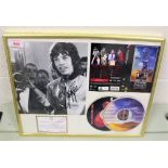 A framed and signed authenticated Mick Jagger compact disc set and photo.