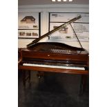 A traditional mahogany cased baby grand piano by John Broadwood