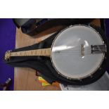 A Goodtime USA made Tenor banjo, in soft gig bag, and a selection of books