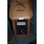 A vintage 'heavy duty avometer' multimeter in leather case.